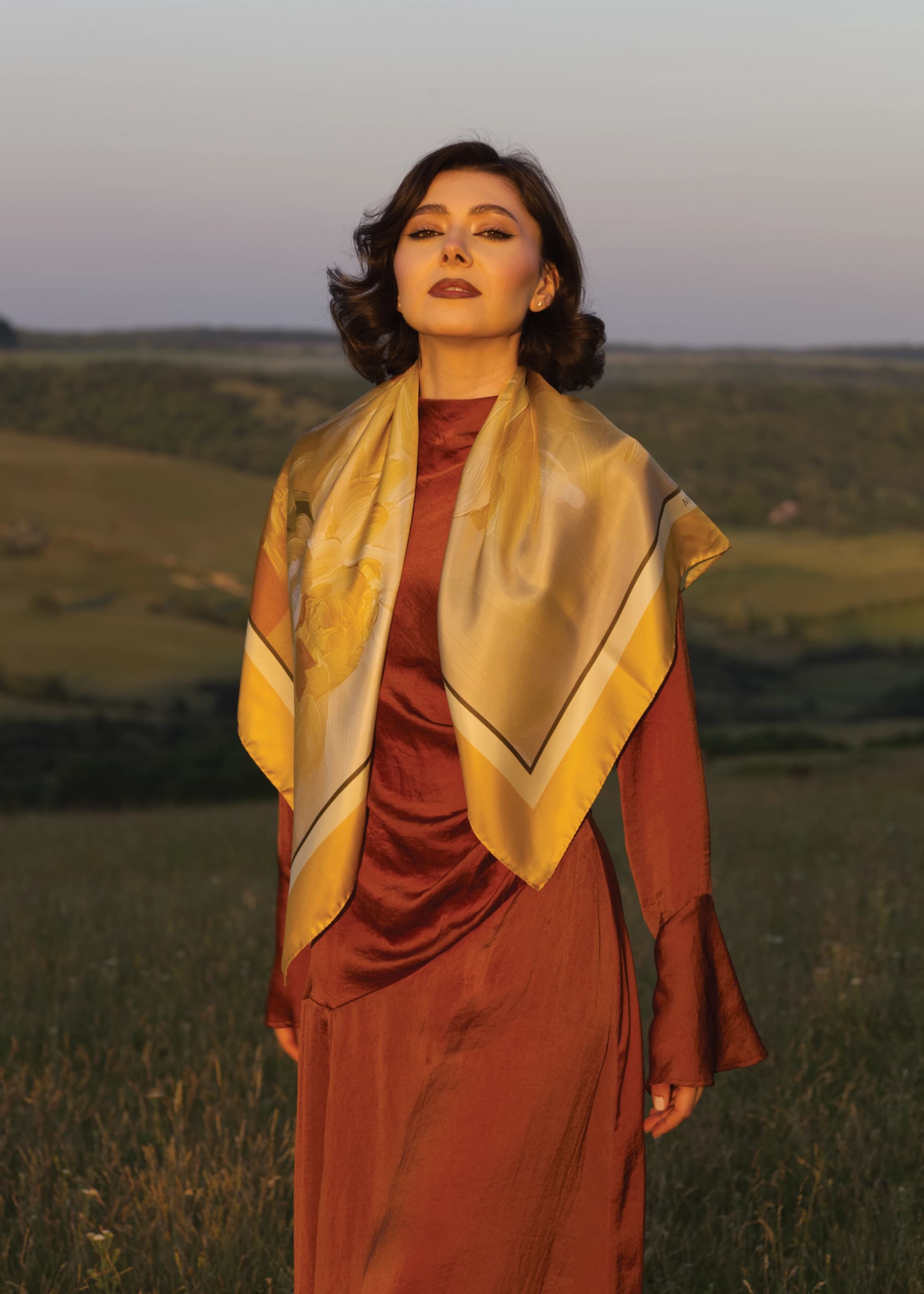 A picture of Maria, the founder of the Marlume brand, showcasing the scarf 'Finding Interior Peace'.